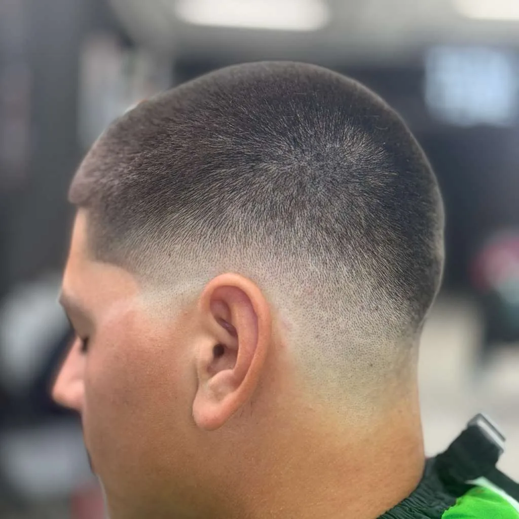 High skin fade close-up, clean blend around the ear at Trim Time Barber