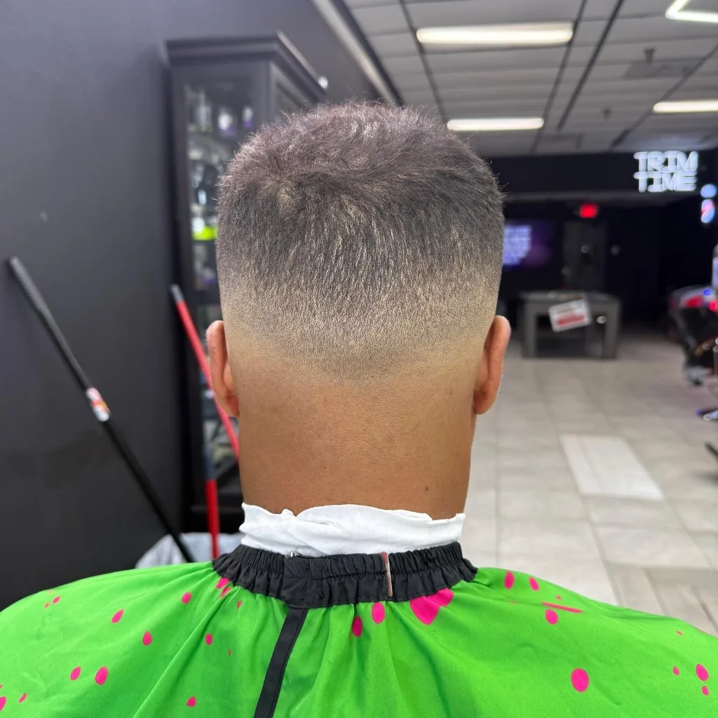 Fresh high skin fade from the back, smooth taper to skin at Trim Time